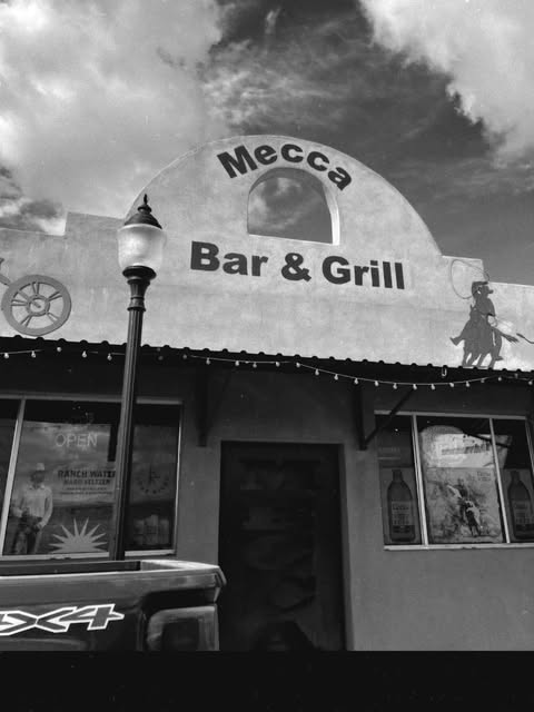 Black and white photo of the Mecca Bar and Grill storefront in Wickenburg, Arizona